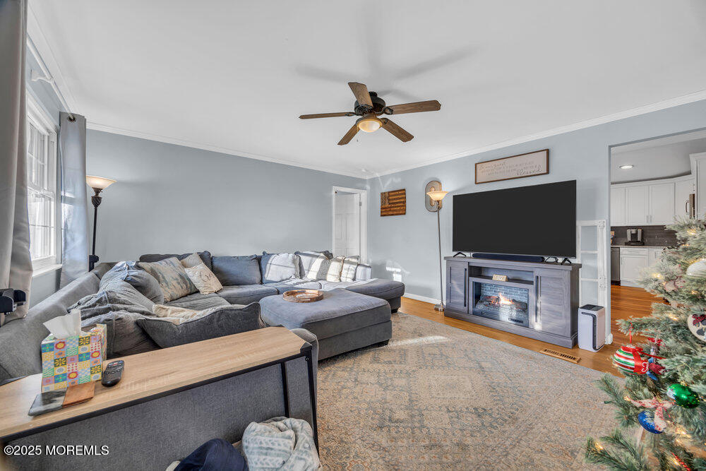 7 Maple Lane Howell, NJ 07731 - Photo 7 of 32 a living room with furniture and a flat screen tv