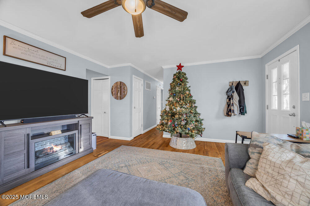 7 Maple Lane Howell, NJ 07731 - Photo 9 of 32 a living room with furniture and a flat screen tv