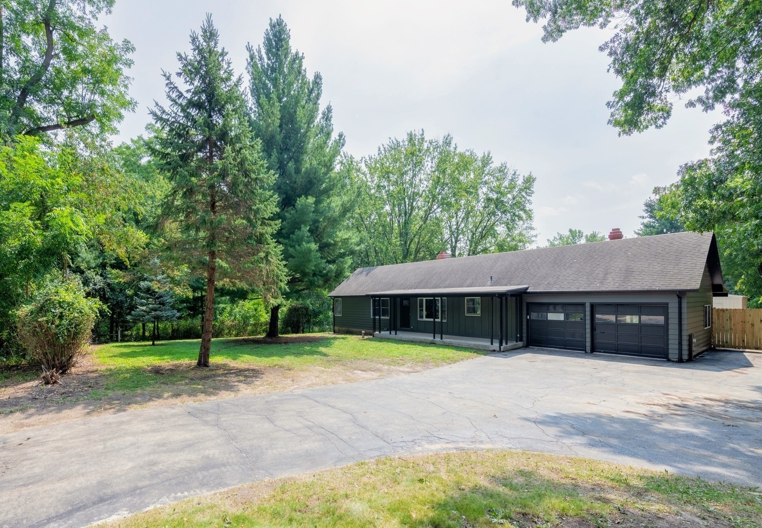 a view of a house with swimming pool and yard