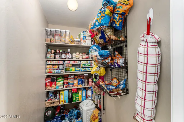 a store room with lots of books and a large window