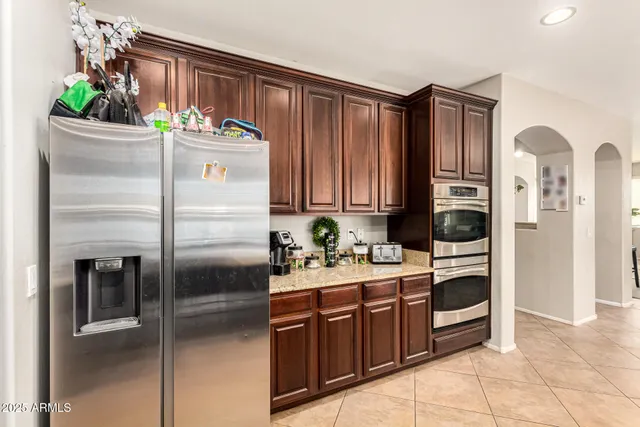 a kitchen with stainless steel appliances a refrigerator and a sink
