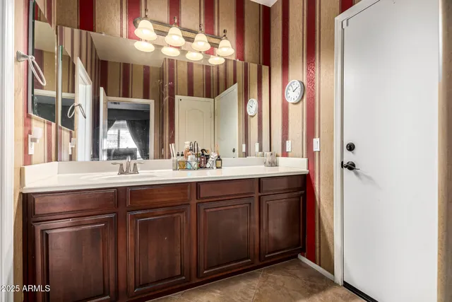 a bathroom with a sink and a mirror