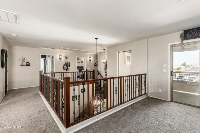 a view of a hallway with windows