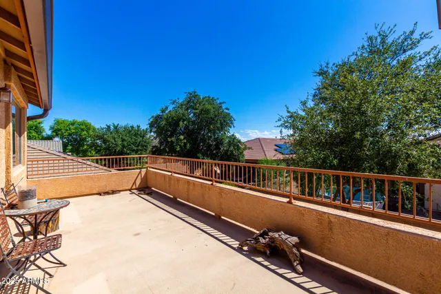 a view of balcony with two trees