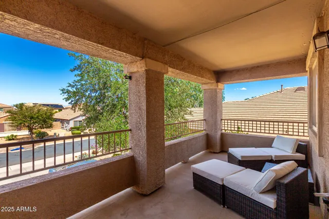 a bedroom with furniture and a window