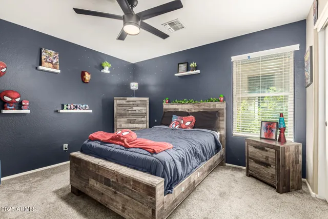 a bedroom with a bed and a couch