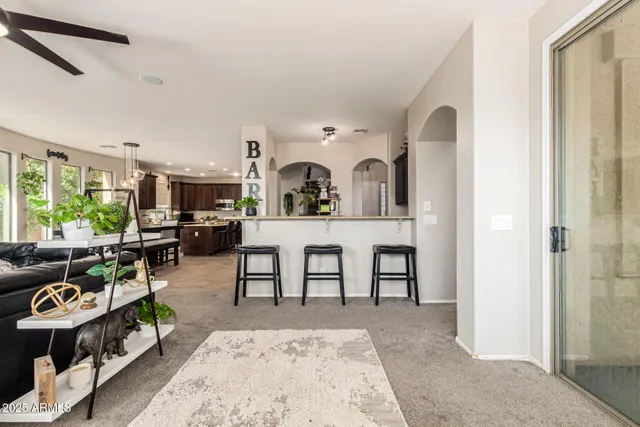 a living room with furniture a window and a table