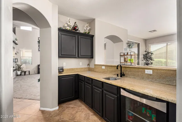 a kitchen with a sink and cabinets