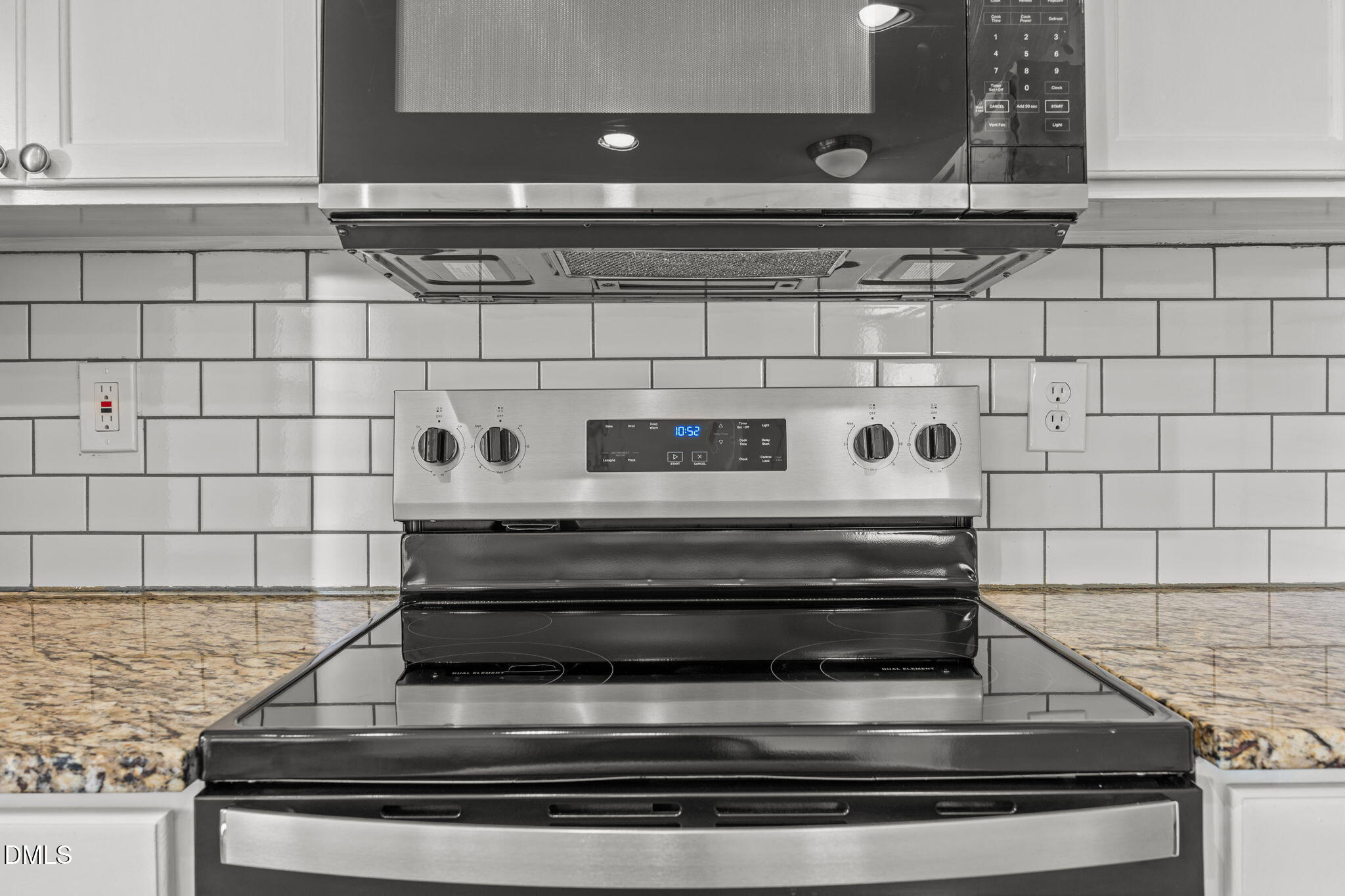 9220 Pennythorne Court Raleigh, NC 27615 - Photo 17 of 49 a stove top oven sitting inside of a kitchen