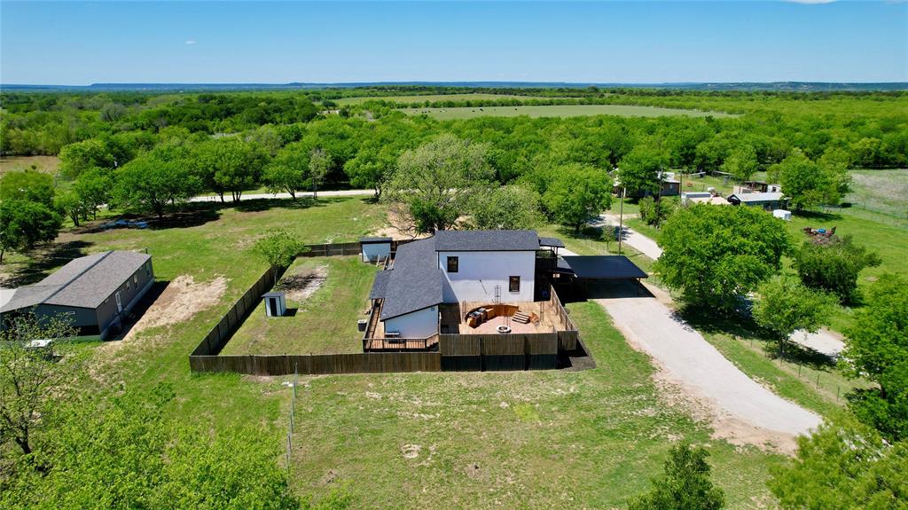 51 3rd Street Graford, TX 76449 - Photo 4 of 40 an aerial view of a house with a yard
