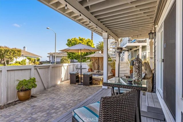an aerial view of a house with a yard and potted plants