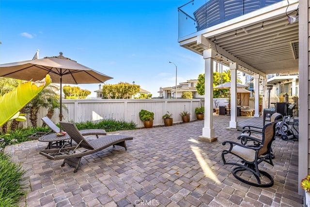 a view of a swimming pool with a patio and a garden