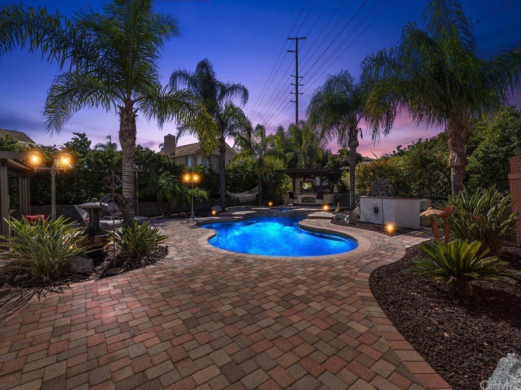 6898 Mission Grove Riverside, CA 92506 - Photo 1 of 1 a view of a backyard with palm trees