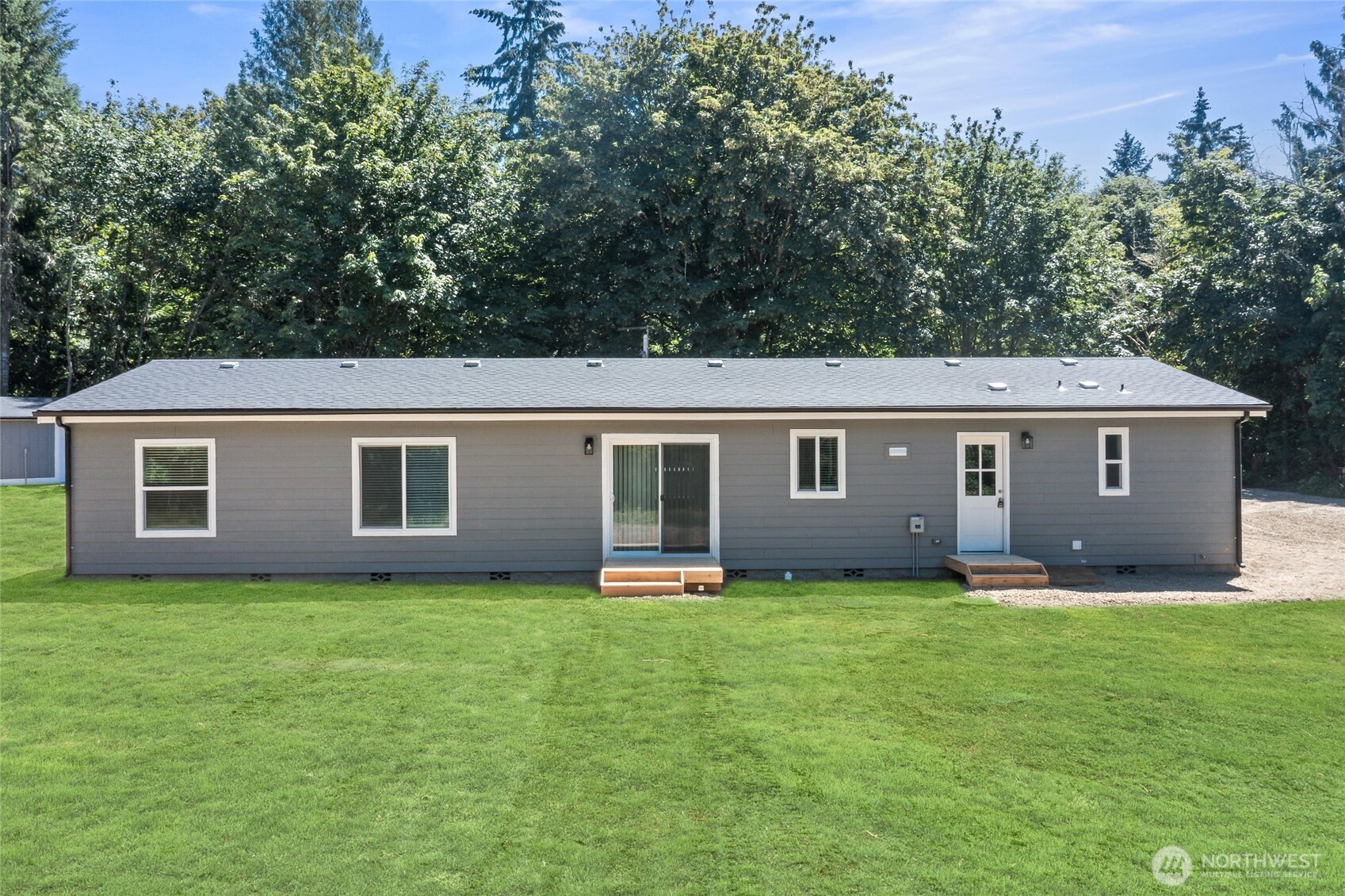 17217 80th Street Southwest Longbranch, WA 98351 - Photo 34 of 39 a view of a house with a yard