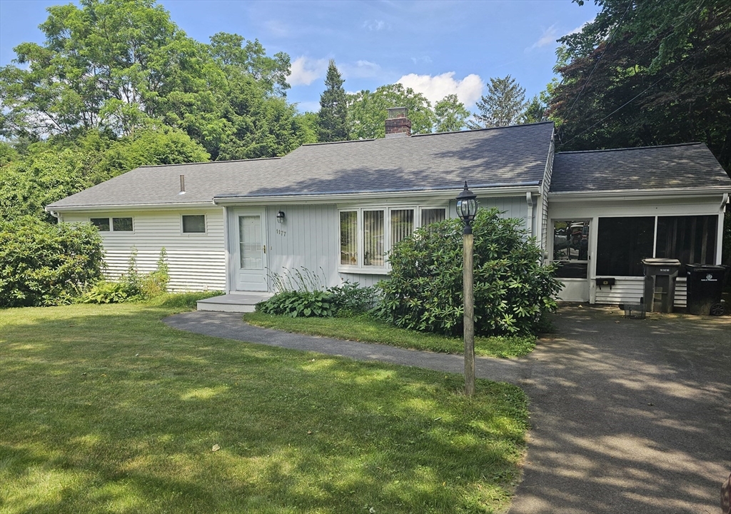 front view of a house with a yard