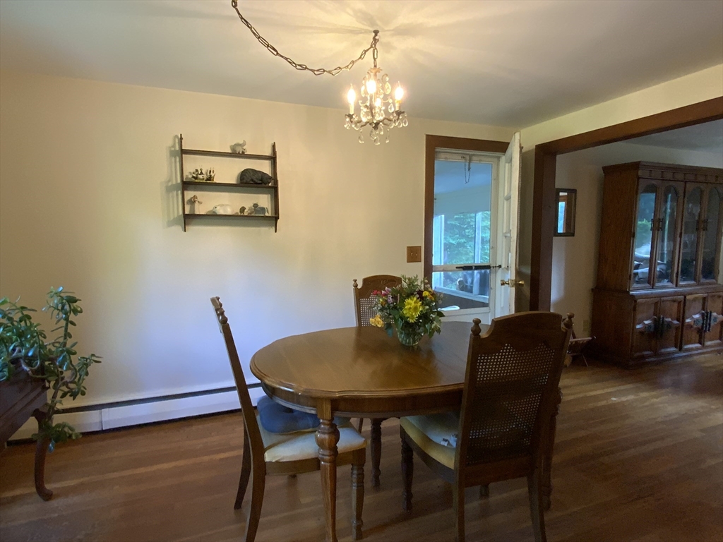 1177 Edgell Road Framingham, MA 01701 - Photo 13 of 32 a view of a dining room with furniture and wooden floor