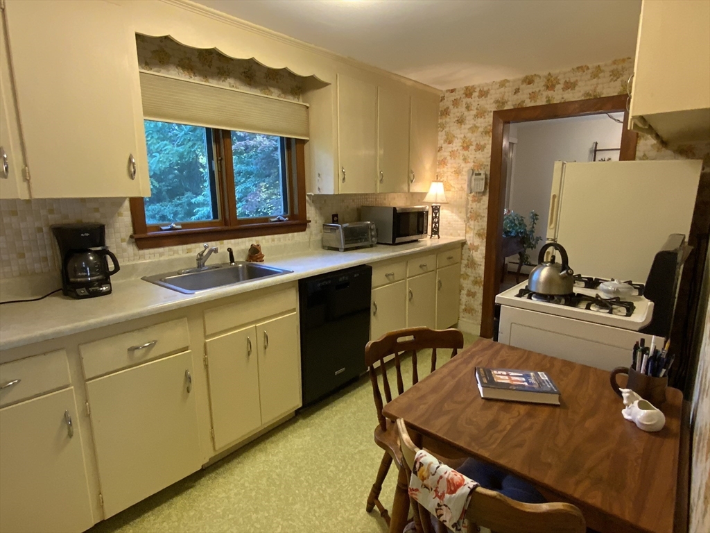 1177 Edgell Road Framingham, MA 01701 - Photo 14 of 32 a kitchen with a sink appliances and cabinets