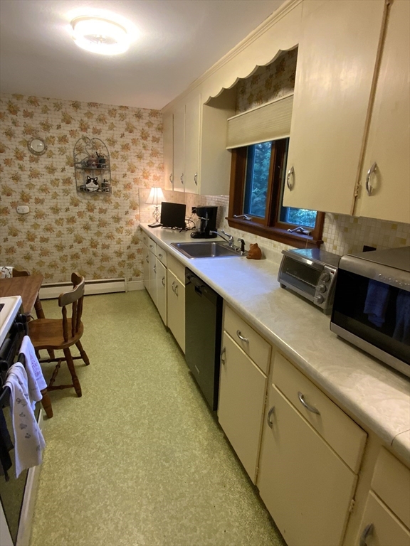 1177 Edgell Road Framingham, MA 01701 - Photo 15 of 32 a kitchen with a sink appliances and cabinets