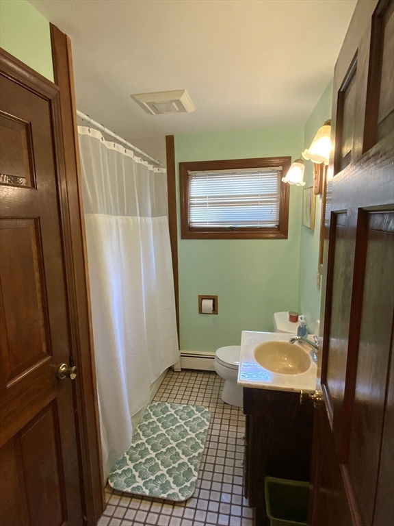 1177 Edgell Road Framingham, MA 01701 - Photo 18 of 32 a bathroom with a sink toilet and shower