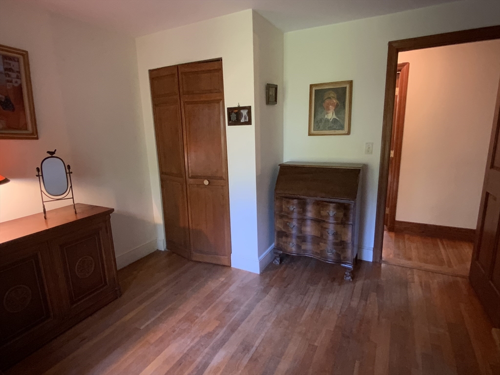 1177 Edgell Road Framingham, MA 01701 - Photo 24 of 32 a room with wooden floor and closet