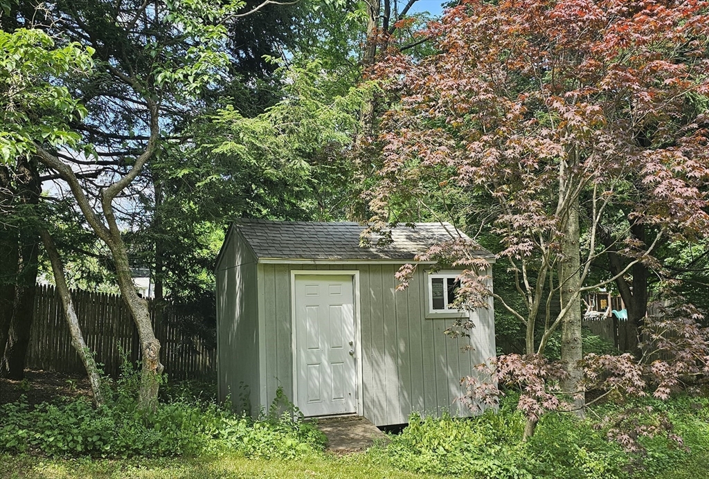 1177 Edgell Road Framingham, MA 01701 - Photo 4 of 32 front view of a house with a tree