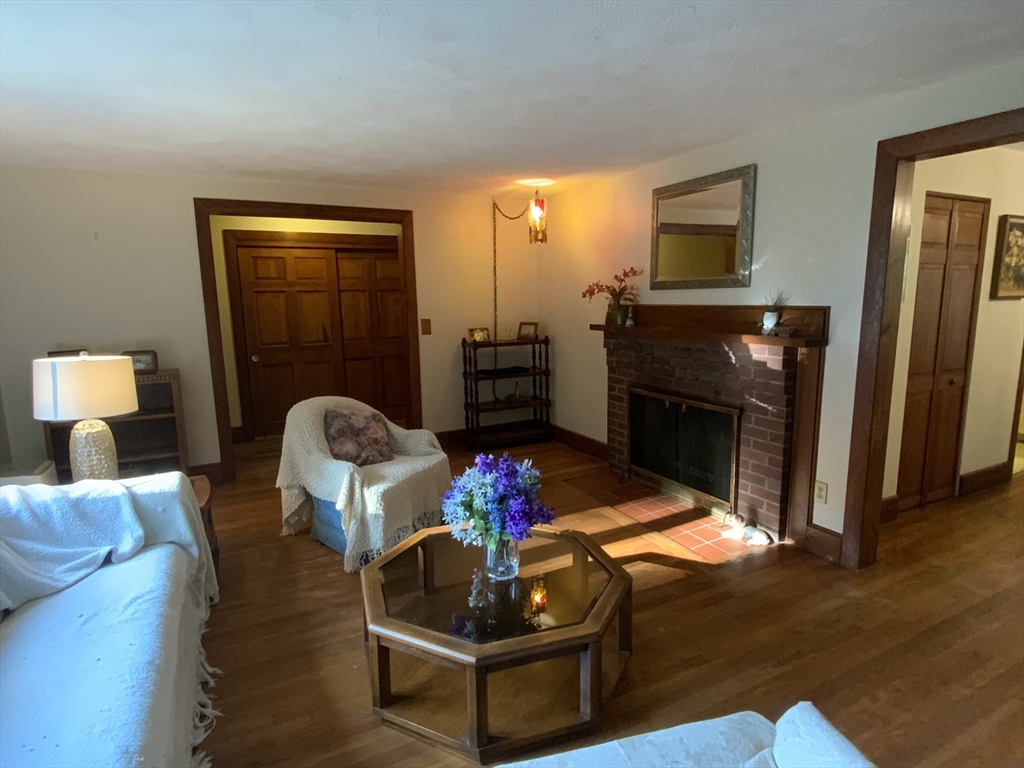 1177 Edgell Road Framingham, MA 01701 - Photo 8 of 32 a living room with furniture and a fireplace