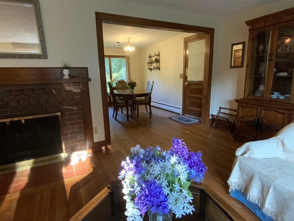 1177 Edgell Road Framingham, MA 01701 - Photo 10 of 32 a living room with furniture and a fireplace