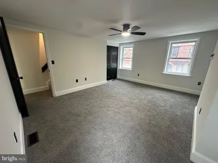 a view of a room with wooden walls