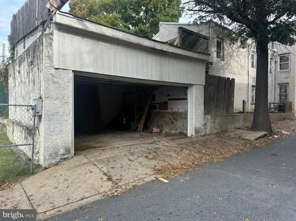 a view of a backyard with table and chairs