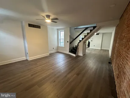 a view of entryway with wooden floor