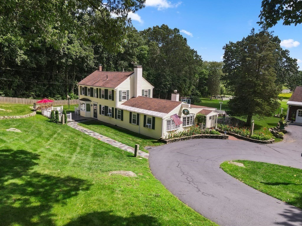 45 Winch Street Framingham, MA 01701 - Photo 1 of 40 an aerial view of a house with a yard table and chairs