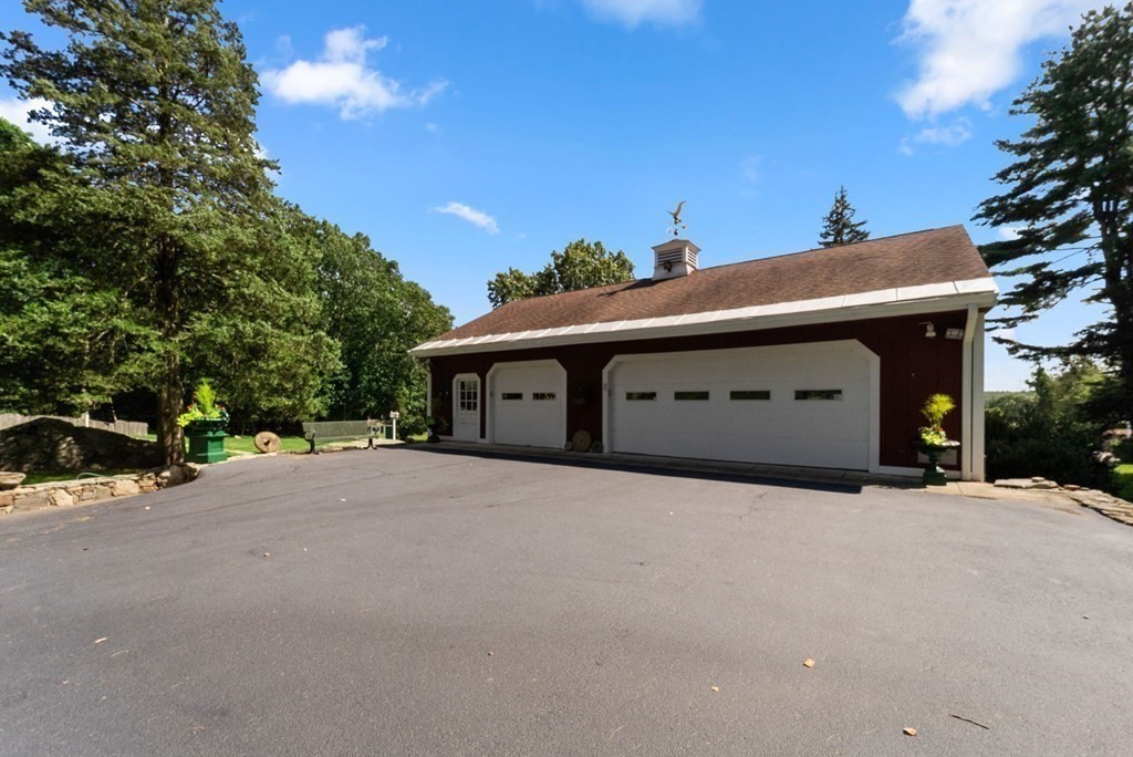 45 Winch Street Framingham, MA 01701 - Photo 12 of 40 a front view of a house with a yard and garage