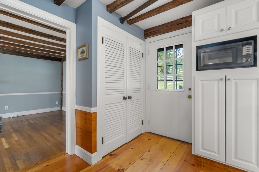 45 Winch Street Framingham, MA 01701 - Photo 16 of 40 a view of a livingroom with wooden floor and staircase