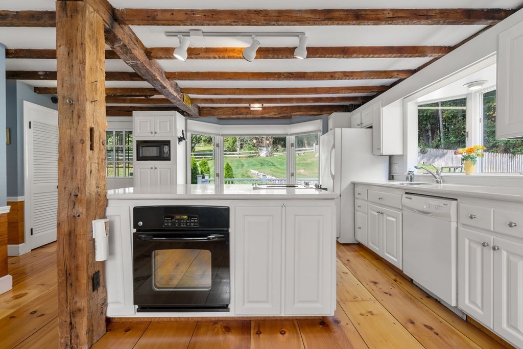 45 Winch Street Framingham, MA 01701 - Photo 21 of 40 a kitchen with a stove top oven and sink