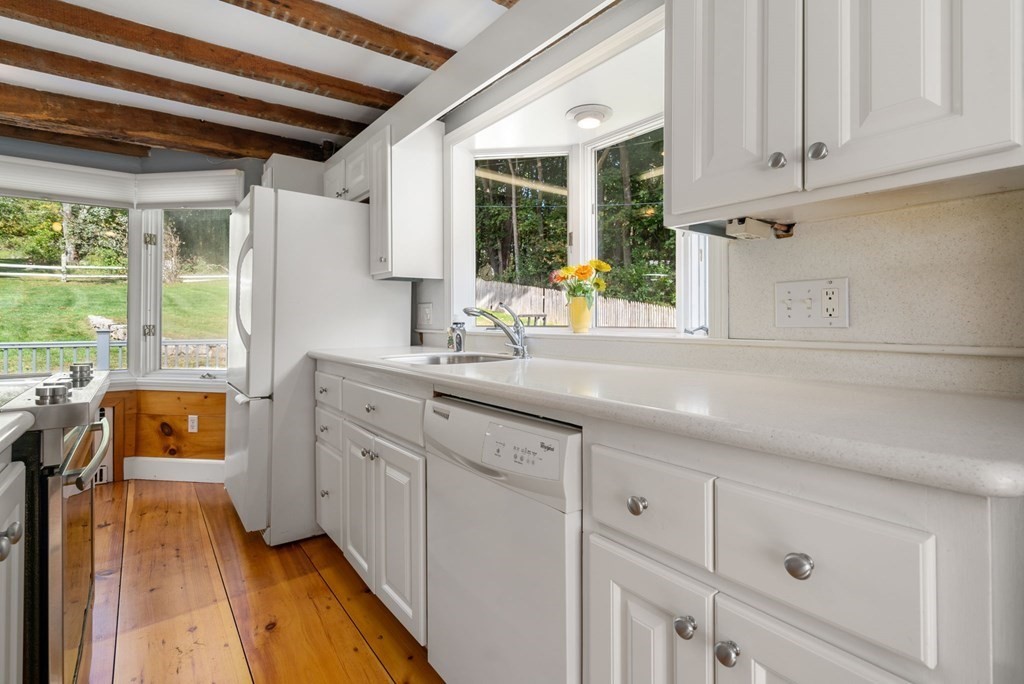 45 Winch Street Framingham, MA 01701 - Photo 22 of 40 a kitchen with stainless steel appliances cabinets a large window and a sink