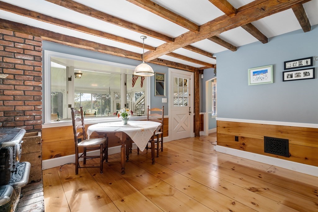 45 Winch Street Framingham, MA 01701 - Photo 23 of 40 a view of a dining room with furniture a chandelier and wooden floor