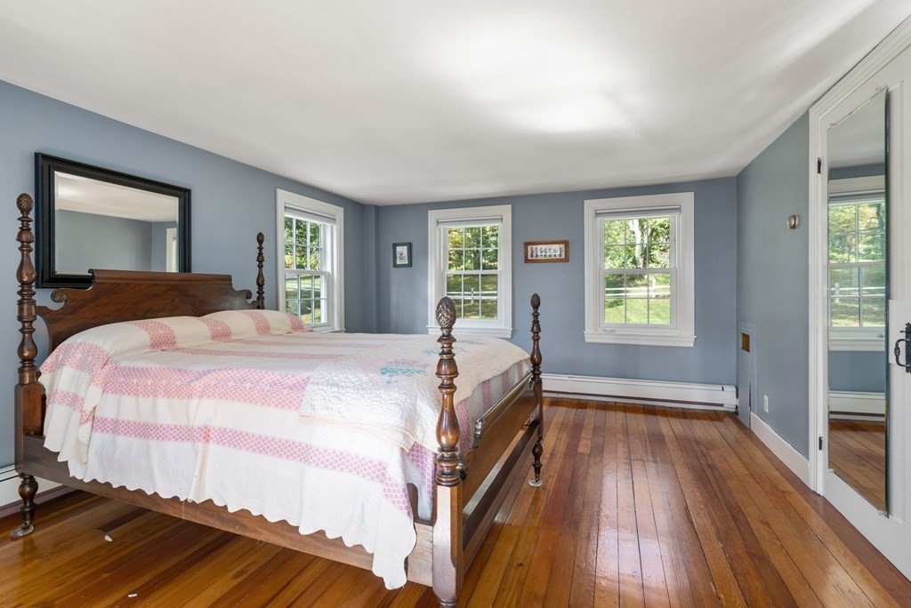 45 Winch Street Framingham, MA 01701 - Photo 30 of 40 a bed sitting in a bedroom next to a window