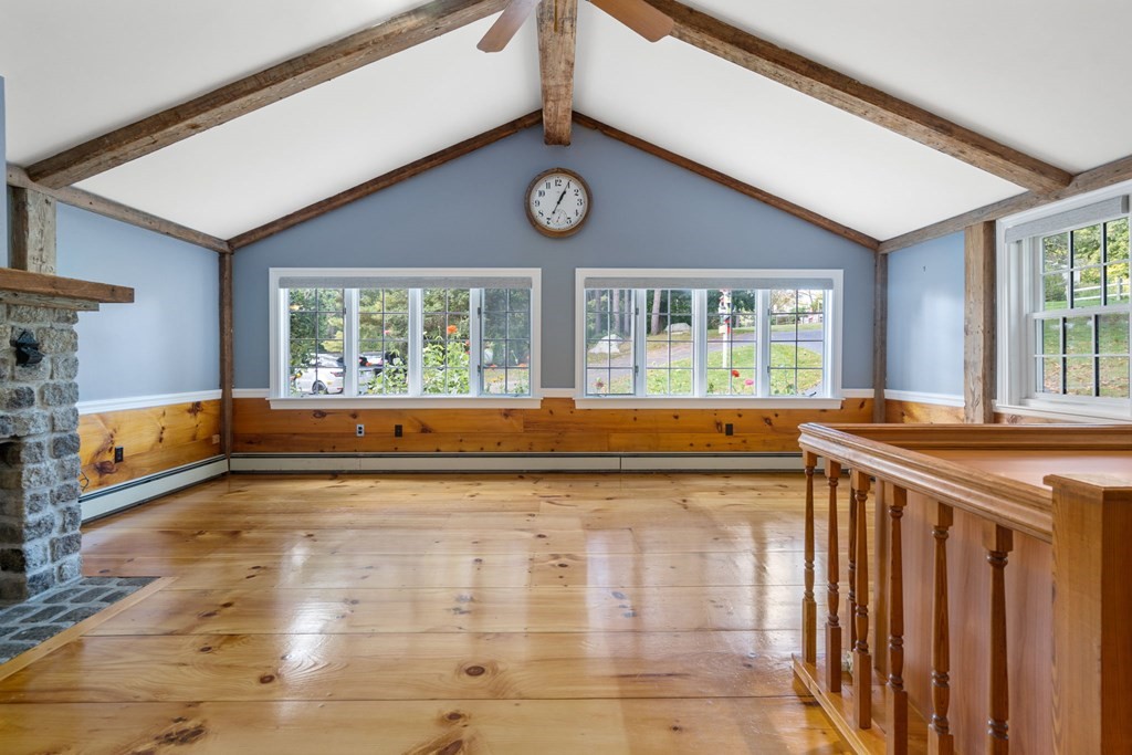 45 Winch Street Framingham, MA 01701 - Photo 34 of 40 a view of a kitchen with a large window and a clock on the wall