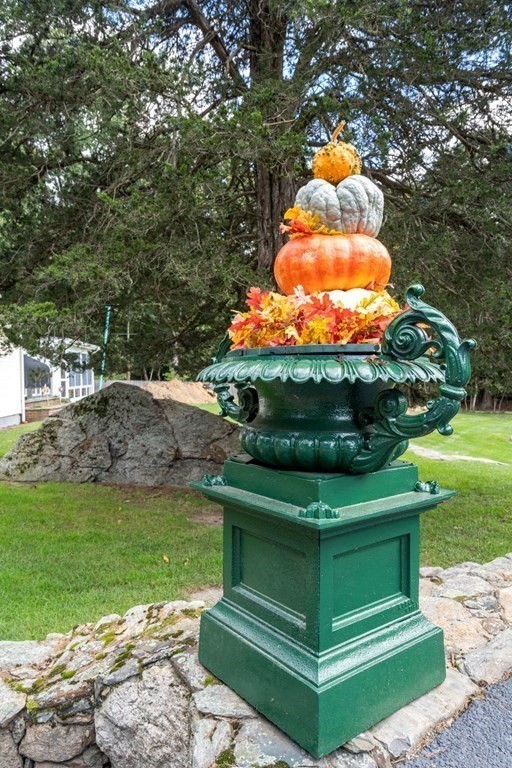 45 Winch Street Framingham, MA 01701 - Photo 7 of 40 a view of a garden with a fountain