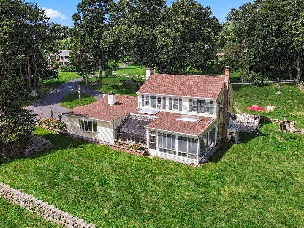 45 Winch Street Framingham, MA 01701 - Photo 8 of 40 a aerial view of a house with a yard table and chairs