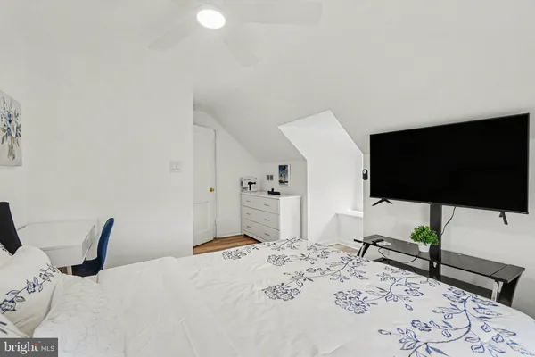 a spacious bathroom with a shower sink and mirror