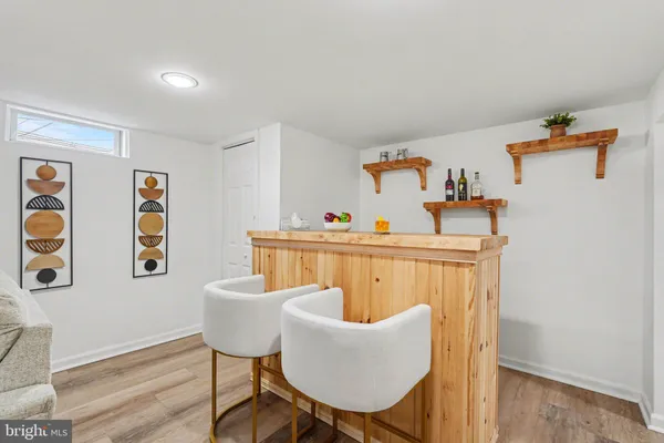 a kitchen with granite countertop a stove and a refrigerator