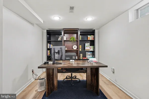 a kitchen with stainless steel appliances granite countertop a sink refrigerator and cabinets