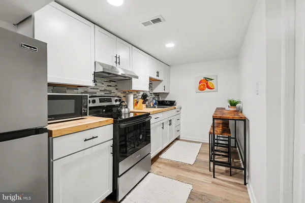 a bedroom with a bed and glass door