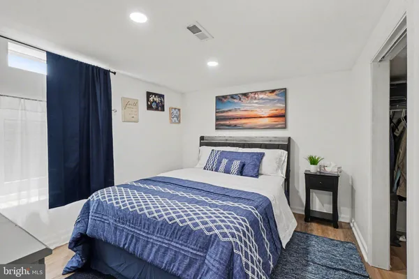 a bathroom with a toilet sink and a mirror