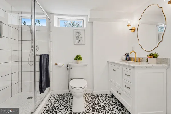 a view of a house with a patio and a yard