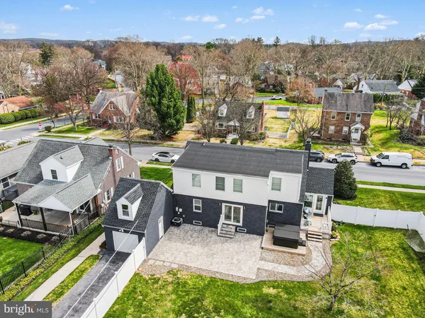 an aerial view of residential houses with outdoor space and street view