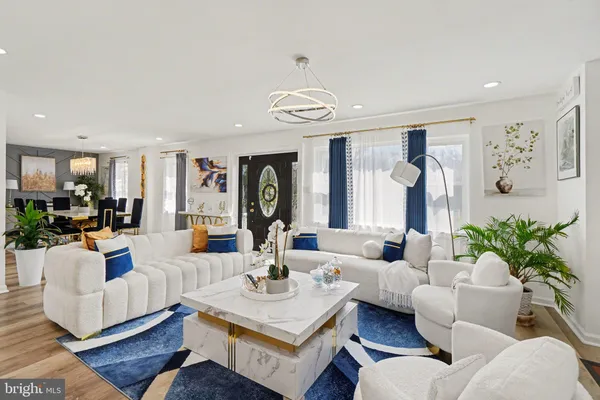 a living room with fireplace furniture and a flat screen tv