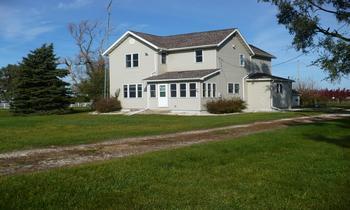 18100 East Ritchie Road Rochelle, IL 61068 - Photo 1 of 1 a front view of a house with a garden
