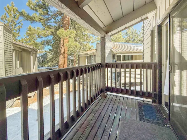 a view of wooden balcony with wooden floor